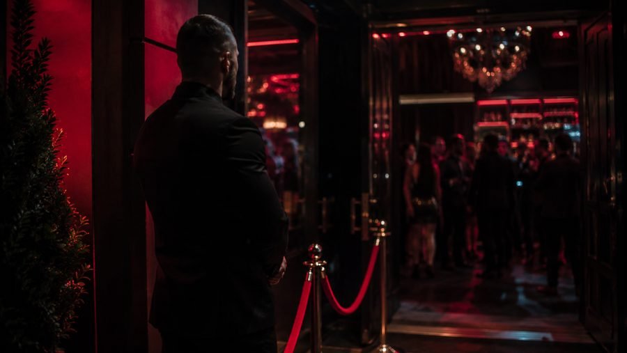 Nightclub and bar security officer at a club entrance